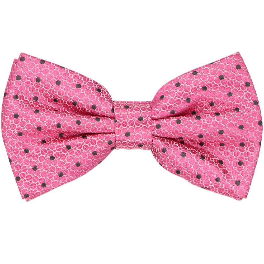 A textured bright pink pre-tied bow tie with gray polka dots 