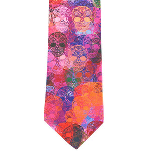 A pink and assorted color sugar skull necktie, laid out flat