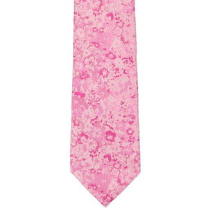The front of a pink floral tie, laid out flat