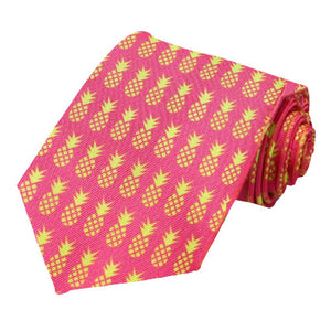 A rolled hot pink tie with a repeated pattern of yellow pineapples