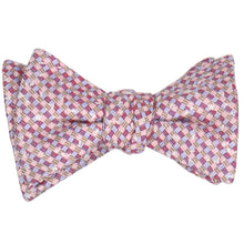 Load image into Gallery viewer, A tied self-tie bow tie in a speckled pink plaid pattern