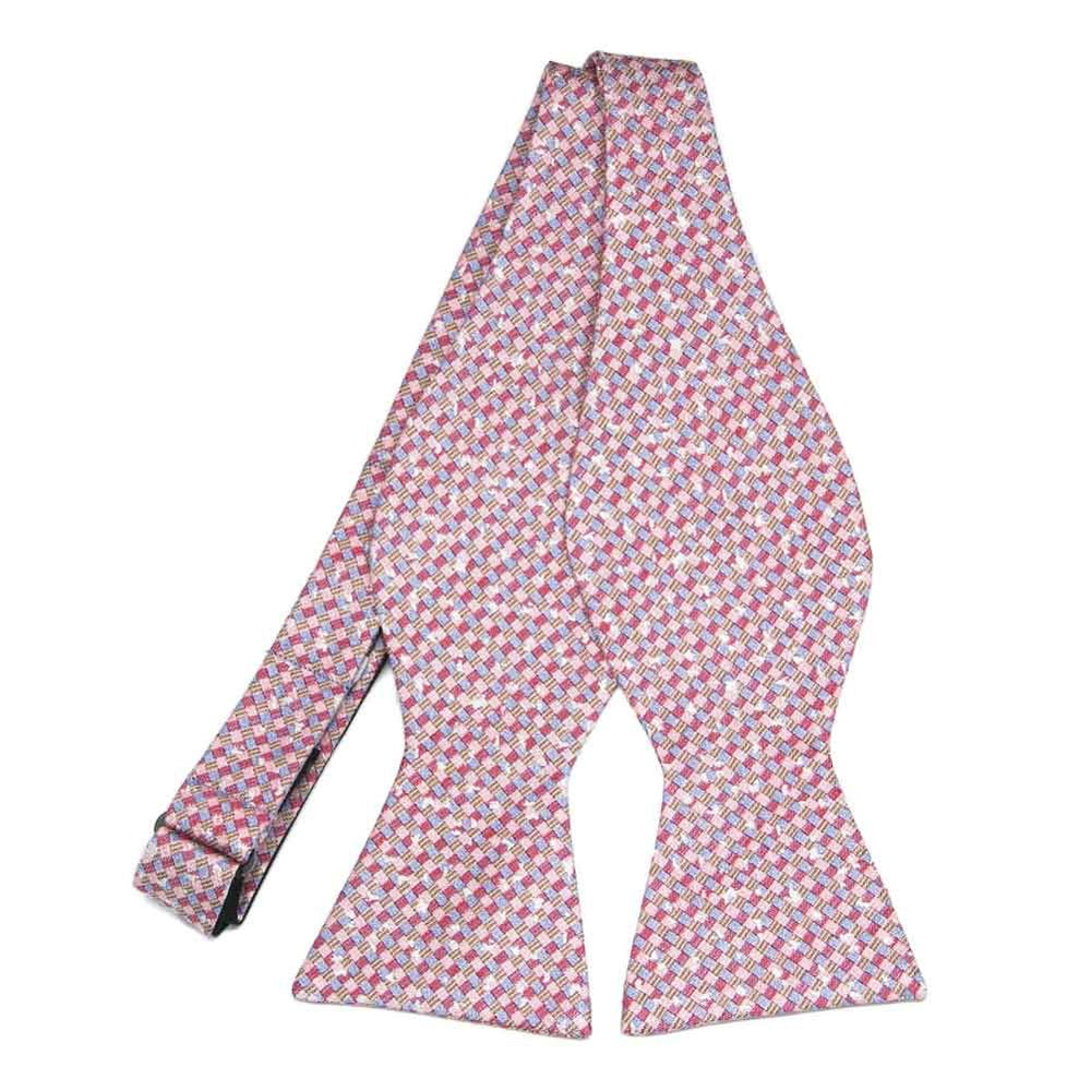 An untied self-tie bow tie in light pink dark pink and white plaid
