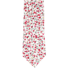 Load image into Gallery viewer, The front of a fuchsia and white small floral tie, laid flat