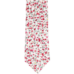 The front of a fuchsia and white small floral tie, laid flat