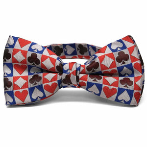 Blue, red, and burgundy card suit bow tie on white background.