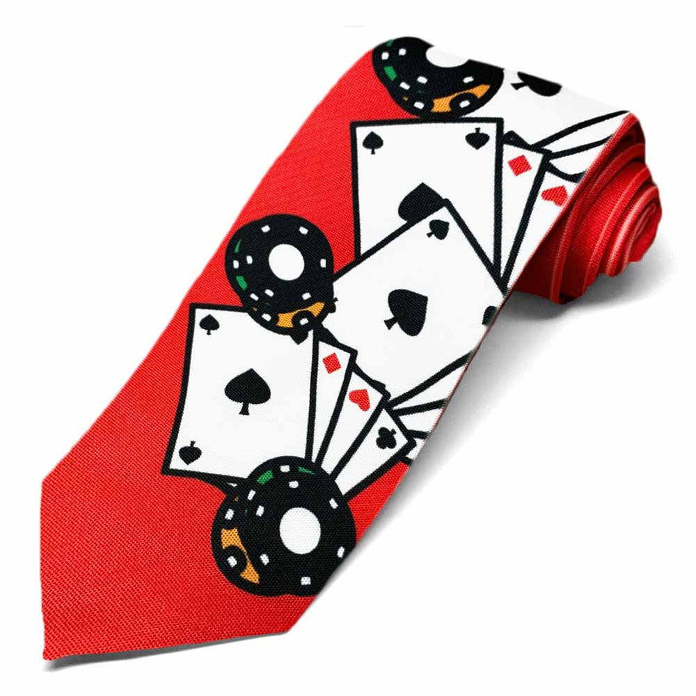 Poker chips and cards on the bottom section of a red tie.