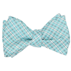 A tied self-tie bow tie in a pool blue and white plaid