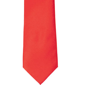 The front of a poppy red solid tie, laid out flat