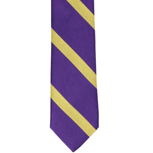 The front bottom view of a purple and gold striped tie