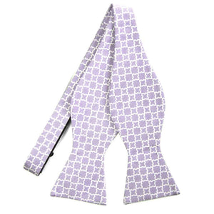 An untied purple self-tie bow tie with a white trellis pattern