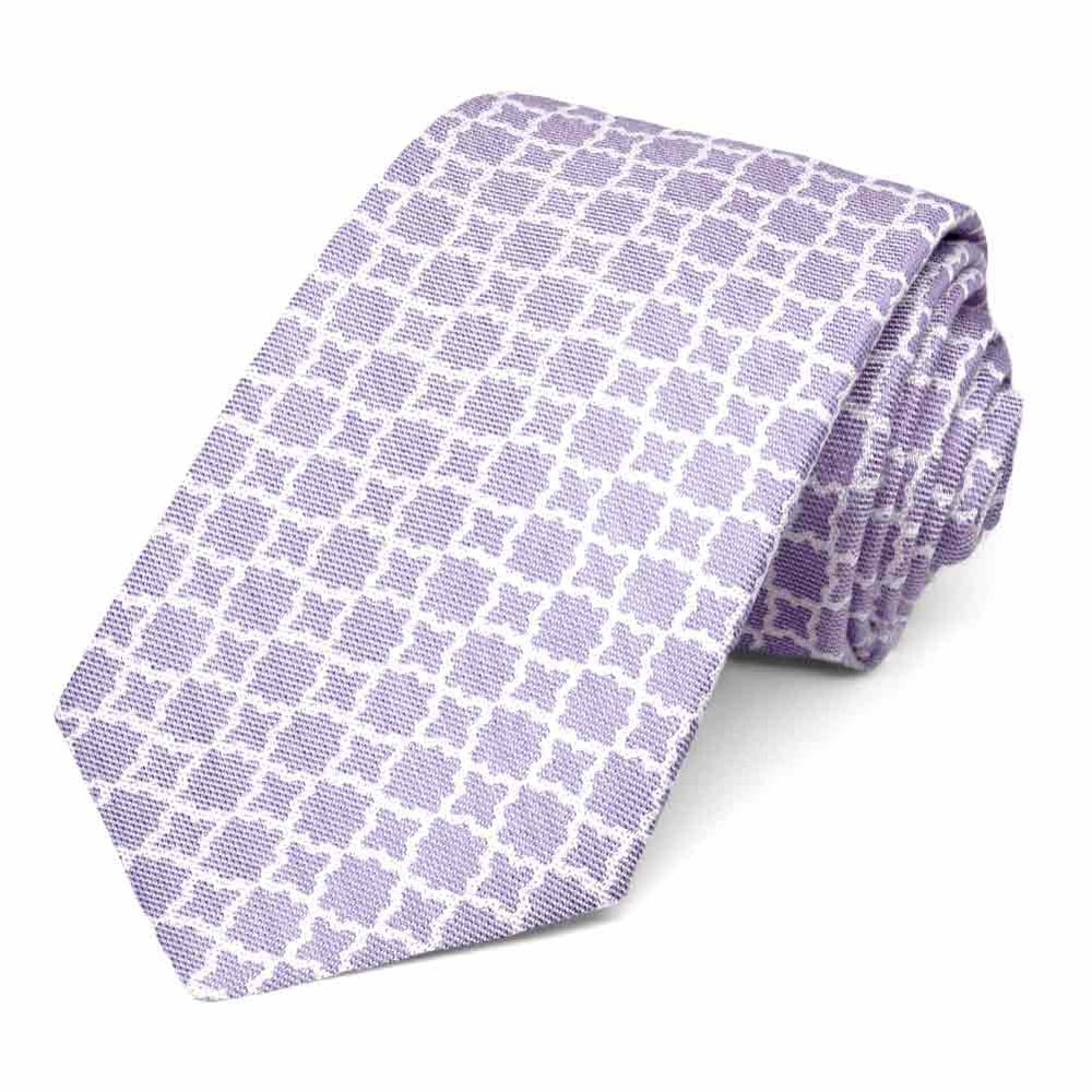 Light purple tie with white trellis pattern, rolled to show texture