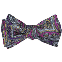 Load image into Gallery viewer, A tied self-tie bow tie in a detailed purple and light orange paisley pattern