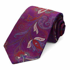 A bright purple paisley necktie, rolled to show off the pattern and texture