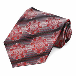 A red and black tie with a large medallion pattern