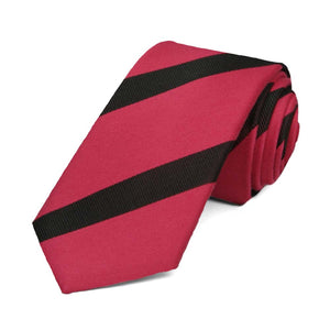 Red and black striped skinny tie, rolled to show the texture of the stripes