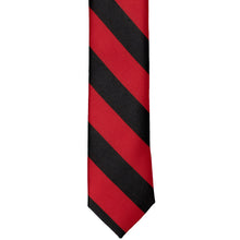 Load image into Gallery viewer, The front of a red and black striped tie, laid out flat