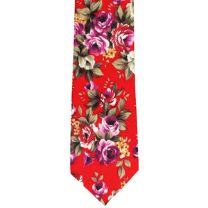 The front of a red and purple floral tie, laid out flat