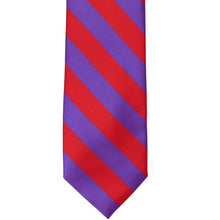Load image into Gallery viewer, The front of a red and purple striped tie, laid out flat.