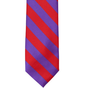 The front of a red and purple striped tie, laid out flat.