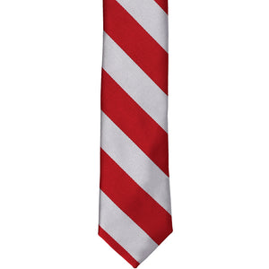 The front of a red and silver striped tie, laid out flat