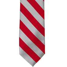Load image into Gallery viewer, The front of a red and silver striped tie, laid out flat