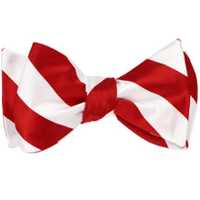 Load image into Gallery viewer, A red and white striped self-tie bow tie, tied