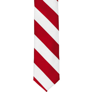 The front of a red and white striped skinny tie, laid out flat