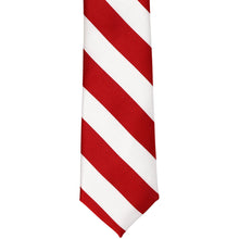 Load image into Gallery viewer, The front of a red and white striped tie, laid out flat