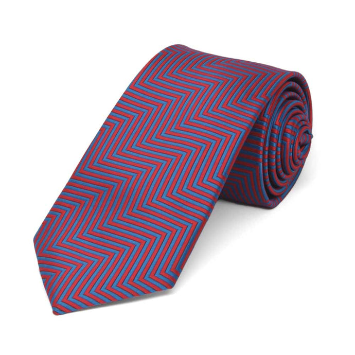 Rolled view of a red and blue chevron pattern slim tie
