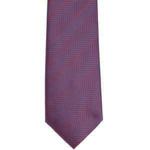 The front of a red and blue chevron striped tie