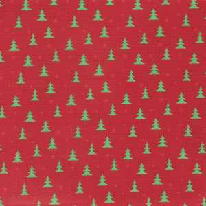 Closeup of a Christmas tree pattern on a red background
