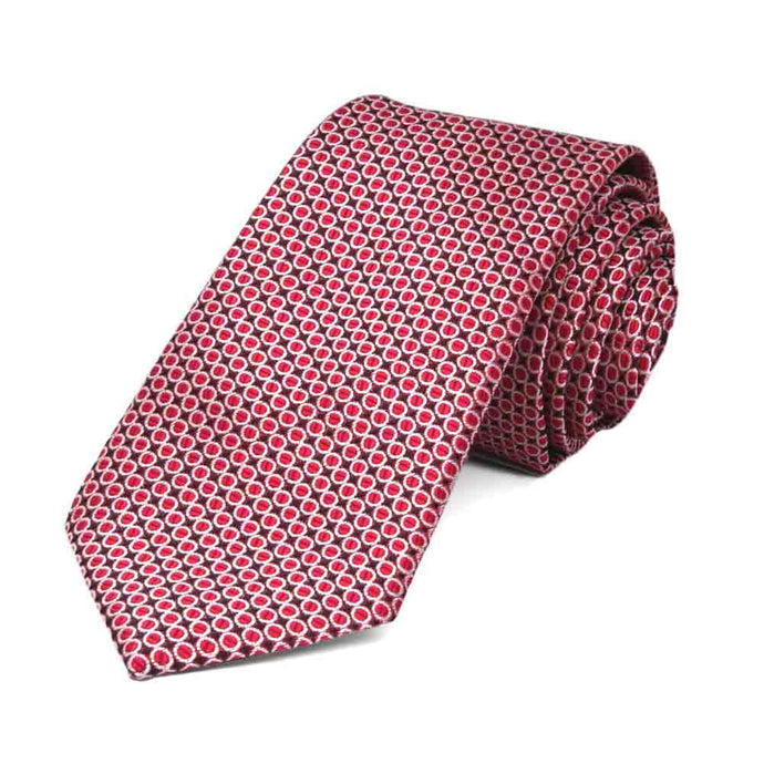 Red circle pattern slim necktie, rolled to show texture