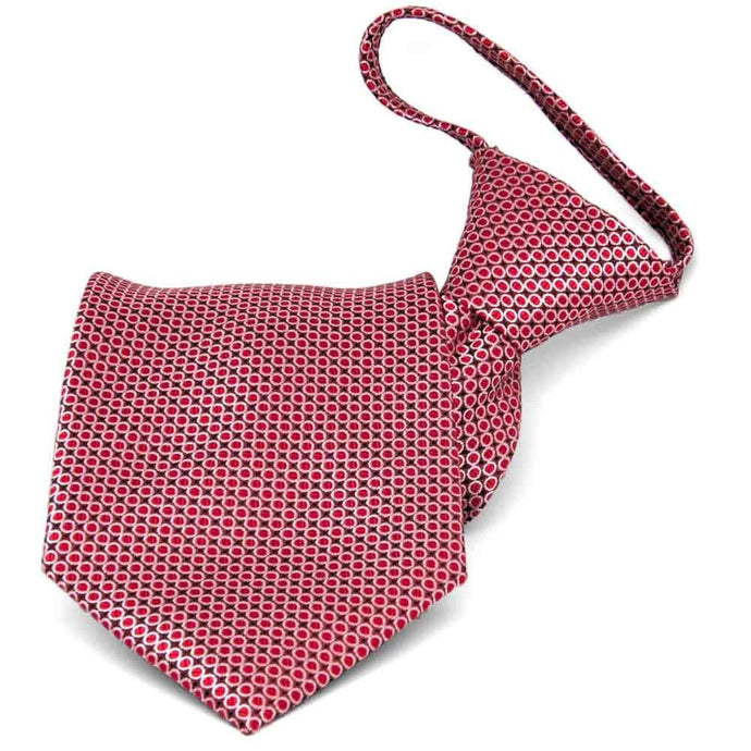 Red circle pattern zipper style tie, folded front view