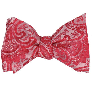 A red tied self-tie bow tie in a paisley pattern