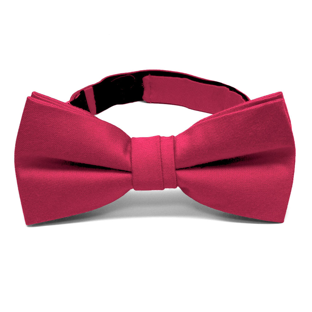 Front view of a pre-tied solid red bow tie