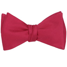 Load image into Gallery viewer, A tied red self-tie bow tie in a solid color