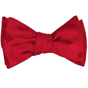 A red tone-on-tone striped self-tie bow tie