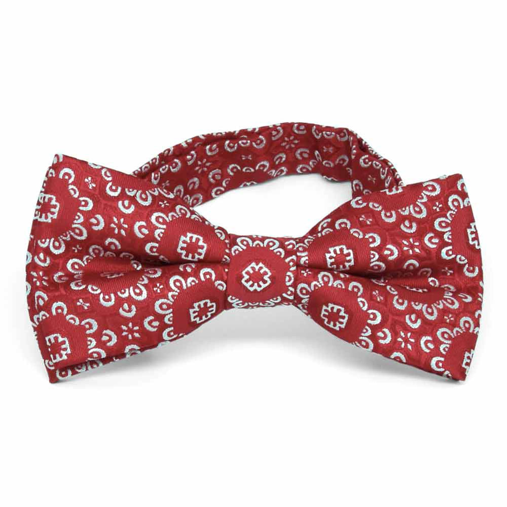 Front view of a red and white floral pattern bow tie