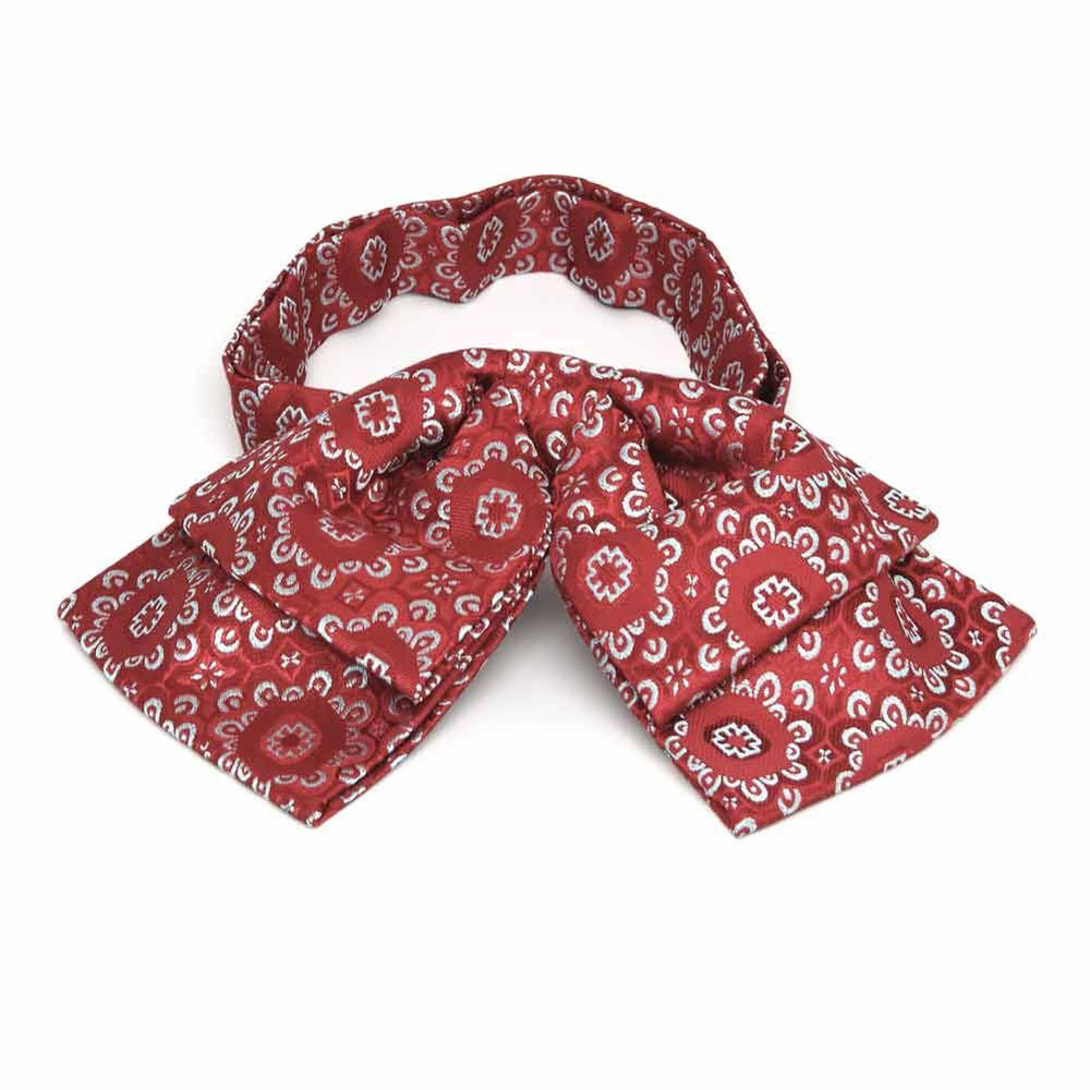 Front view of a red and white floral pattern floppy bow tie