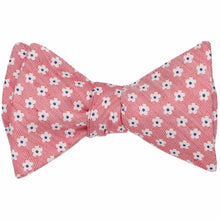 Load image into Gallery viewer, A red tied self-tie bow tie with a white and navy small floral pattern
