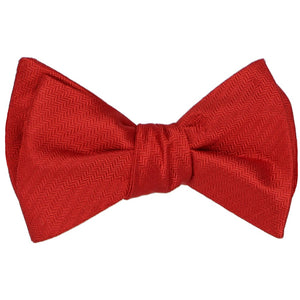 A tied self-tie bow tie in a red tone-on-tone herringbone pattern