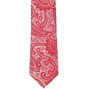 The front tip of a red paisley slim tie