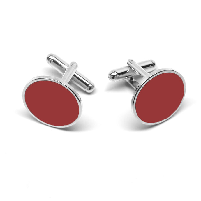 Silver background cufflinks with a round red face.