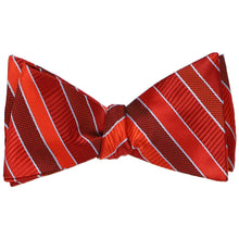 Load image into Gallery viewer, A tied self-tie bow tie in a red striped pattern