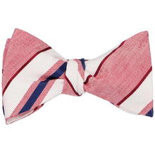 Load image into Gallery viewer, A red, white and blue textured striped self-tie bow tie, tied