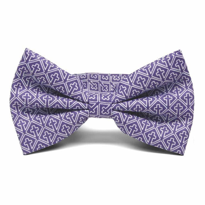 A purple pre-tied bow tie with a white outlined religious cross pattern