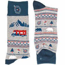 Load image into Gallery viewer, A pair of folded road trip themed socks with mountains, an RV, bears and trees