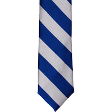 Load image into Gallery viewer, The front of a royal blue and silver striped tie, laid out flat