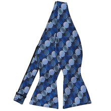 Load image into Gallery viewer, An untied self-tie bow tie in a royal blue, light blue and navy blue dotted pattern