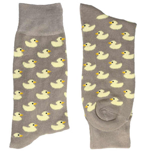 A folded pair of gray socks with light yellow rubber duckies